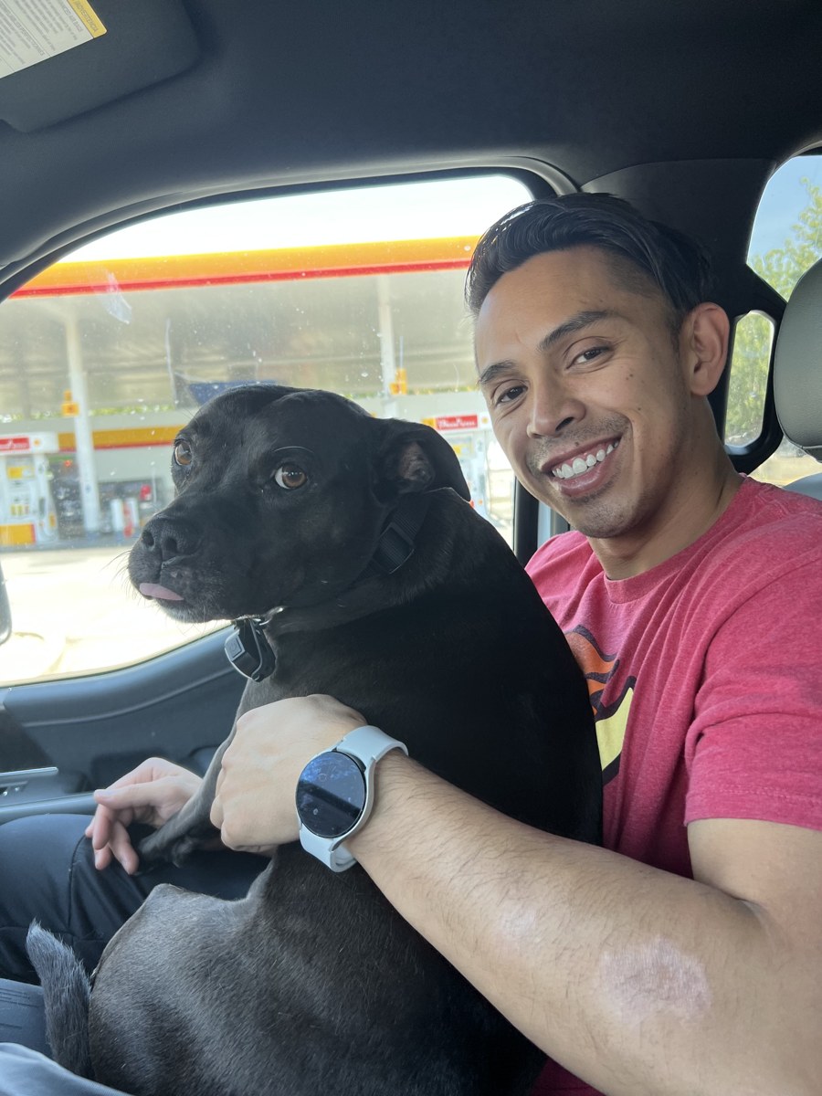 Brian, co-founder of WKND, with a black dog